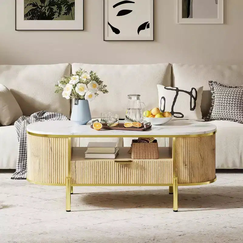 Table basse cannelée moderne COZONY avec tiroir, dessus ovale en faux marbre de 48" et pieds dorés pour salon