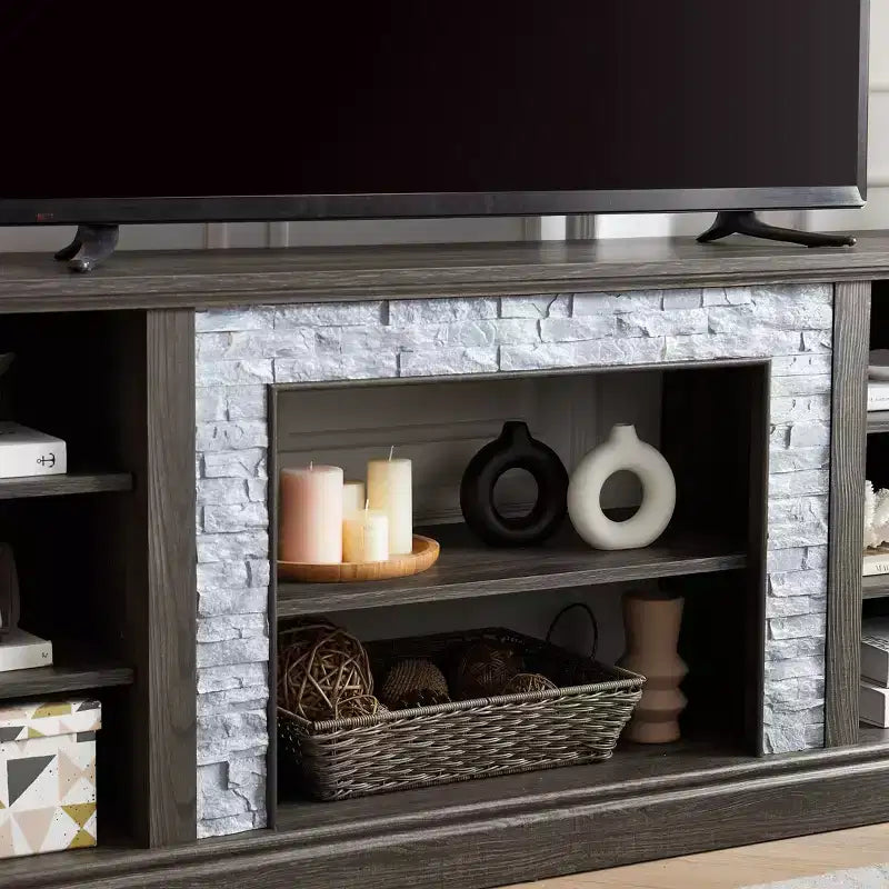 Meuble TV TUYOHW pour téléviseurs jusqu'à 75 pouces, console multimédia de style campagnard avec contour en fausse pierre empilée et étagères ouvertes