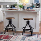 Lot de 2 tabourets de bar réglables Tormo en métal et bois vieilli noirs - Powell : pivotants, assise ronde, design industriel