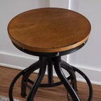 Lot de 2 tabourets de bar réglables Tormo en métal et bois vieilli noirs - Powell : pivotants, assise ronde, design industriel