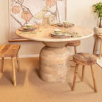 Table de salle à manger en bois de manguier Storied Home Naturelle : Finition blanchie, Piétement colonne, 119 cm de diamètre