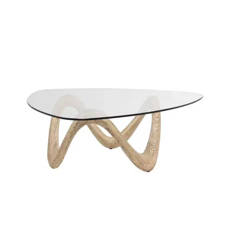 Table basse abstraite Olivia & May Cement avec base abstraite ondulée et plateau en verre triangulaire beige