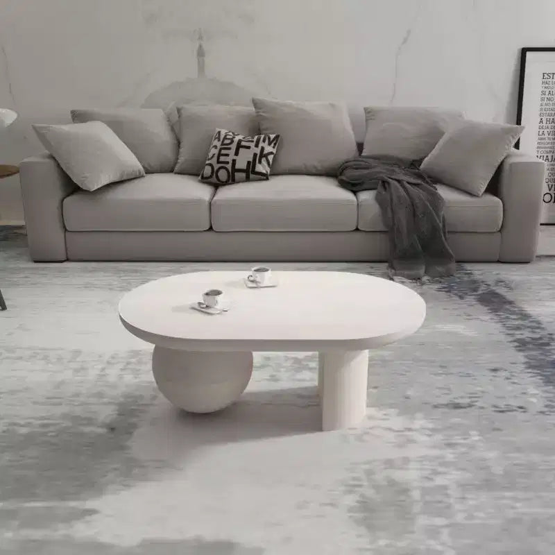 Table basse Urban Port de 96,5 cm avec plateau oblong en bois de manguier et pieds boules modernes, coloris blanc délavé
