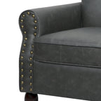 Fauteuil club en similicuir à têtes de clou