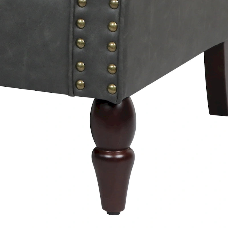 Fauteuil club en similicuir à têtes de clou
