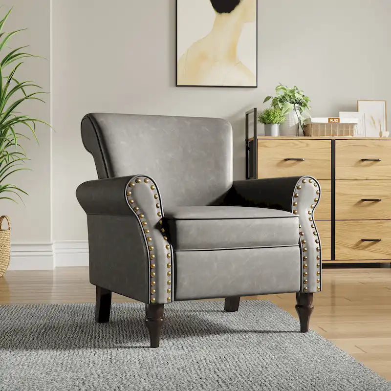 Fauteuil club en similicuir à têtes de clou
