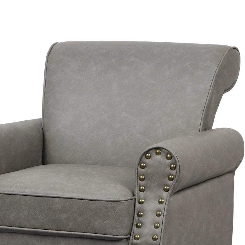 Fauteuil club en similicuir à têtes de clou